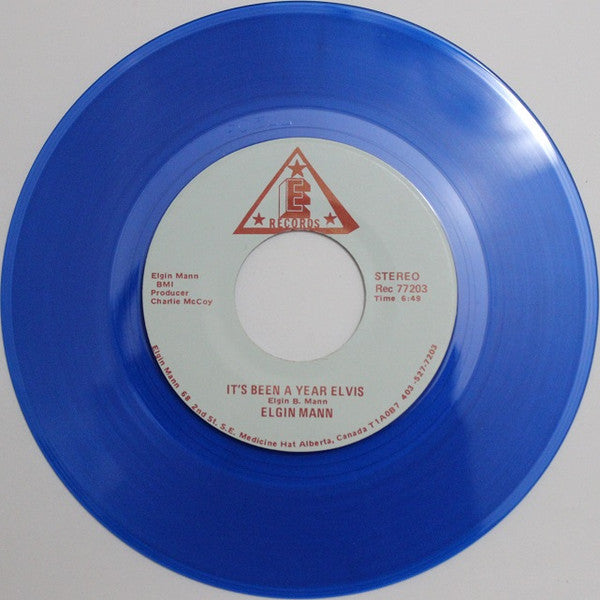 Elgin Mann : It's Been A Year Elvis / Don't You Know I Love You (7", Blu)
