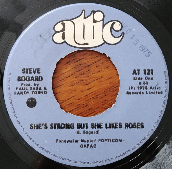 Steve Bogard : She's Strong But She Likes Roses/They Ride Down From The Mountain (7", Single)
