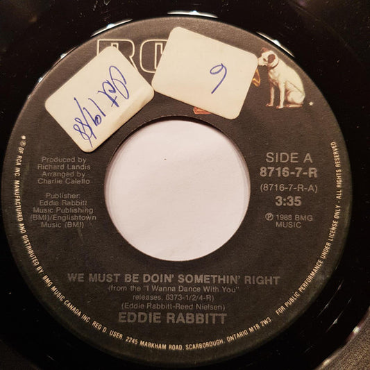 Eddie Rabbitt : We Must Be Doin' Somethin' Right / He's A Cheater (7", Single)