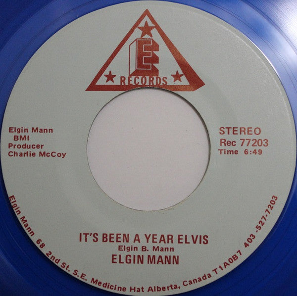 Elgin Mann : It's Been A Year Elvis / Don't You Know I Love You (7", Blu)