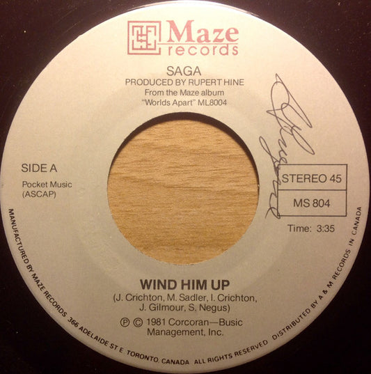 Saga (3) : Wind Him Up (7", Single)